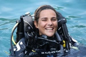 Girl in scuba gear smiling 1024x683