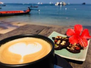 coffee and flower with beach view