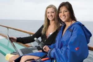divers with laptop on the boat