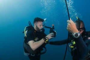 diving instructor with student practicing skills