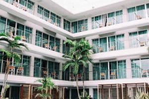 green hotel with palmtrees 1024x683