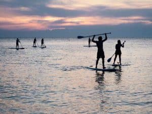 sup paddleboarding friends shallow bay