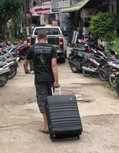 traveller carrying a suitcase